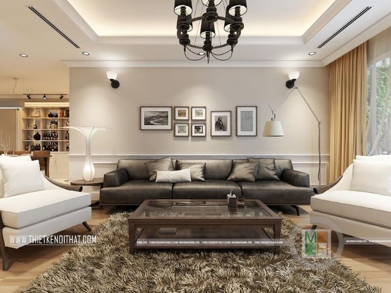 Mẫu thiết kế nội thất phòng khách trong chung cư được trang bị bộ sofa da cao cấp màu đèn trắng để tạo nên điểm nhấn nổi bật cho căn phòng.